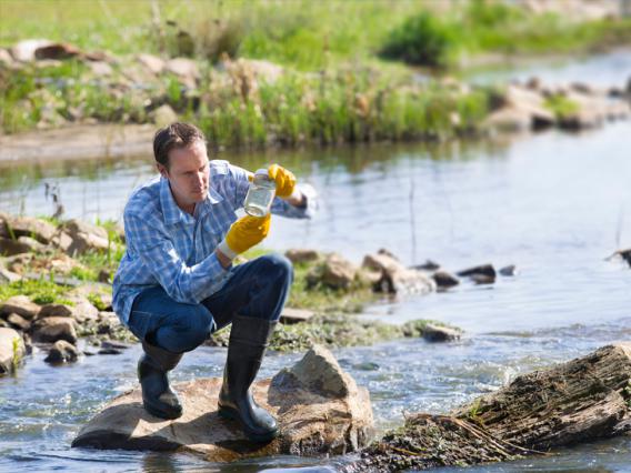 photo of a man testing water